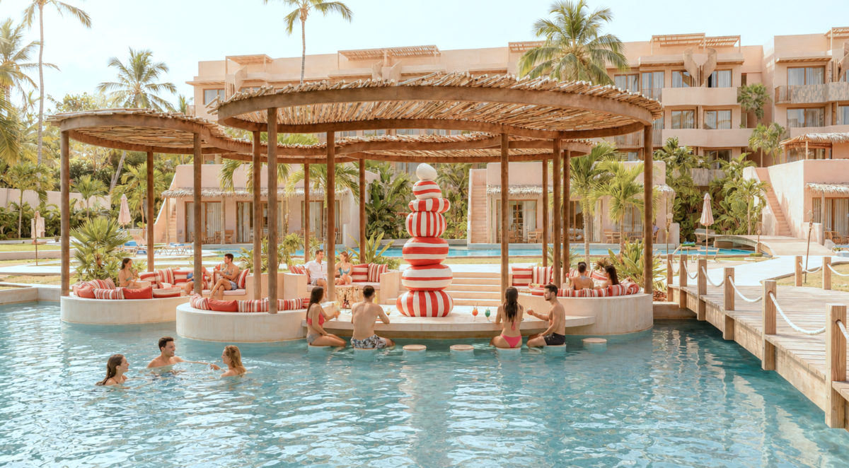 Isla privada de The Don Dom con áreas de relax, pool bar y espacios sociales rodeados por la laguna cristalina.